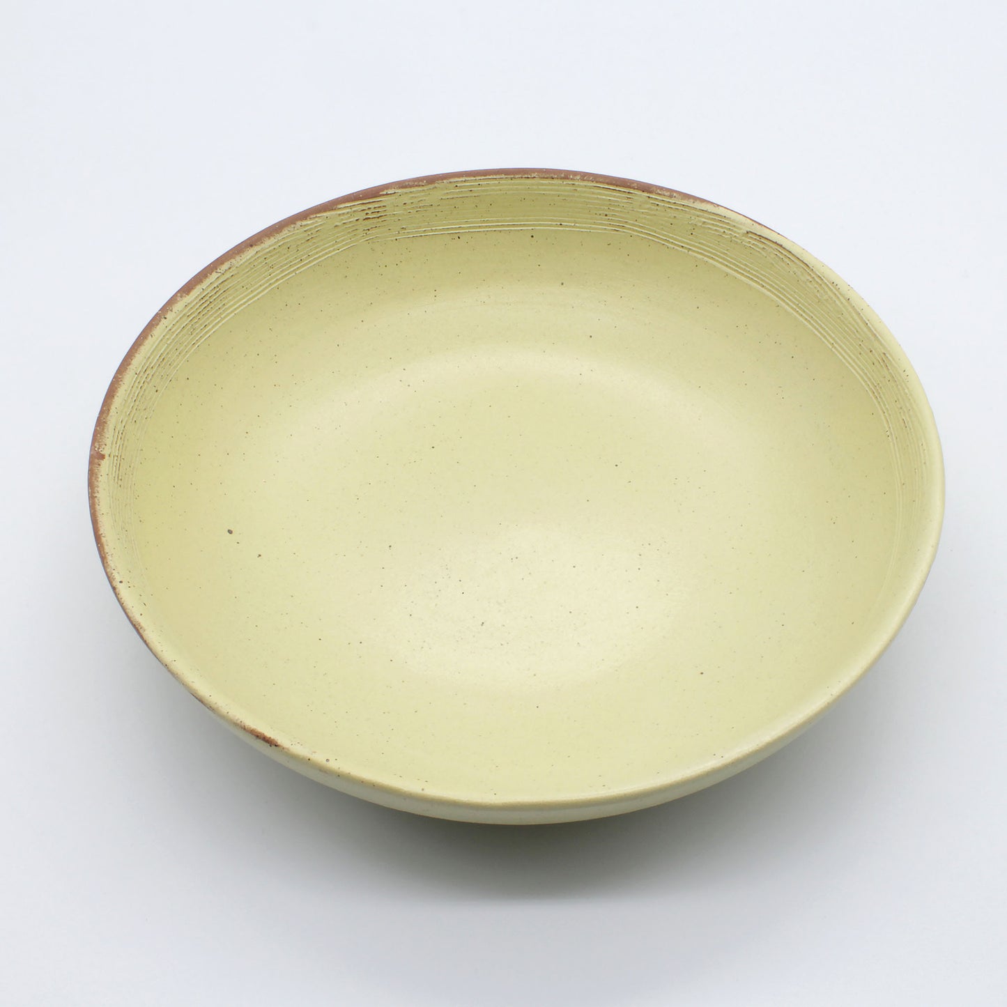 Beautiful handmade ceramic pasta bowl from Thailand, yellow and natural clay rustic