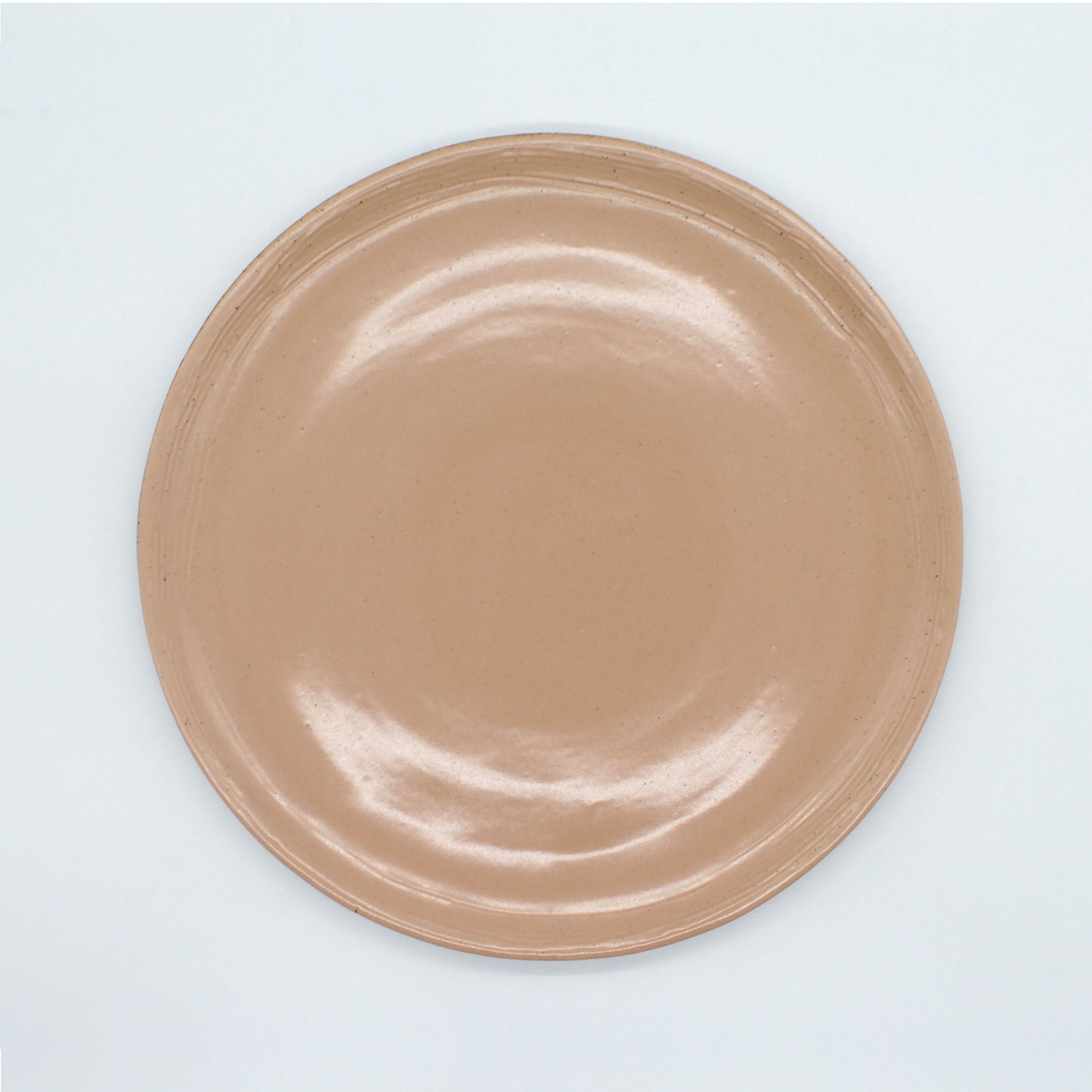 Beautiful handmade dinner plate from our Isariya collection, peach colour and with fine dark speckles. A rustic, natural look.