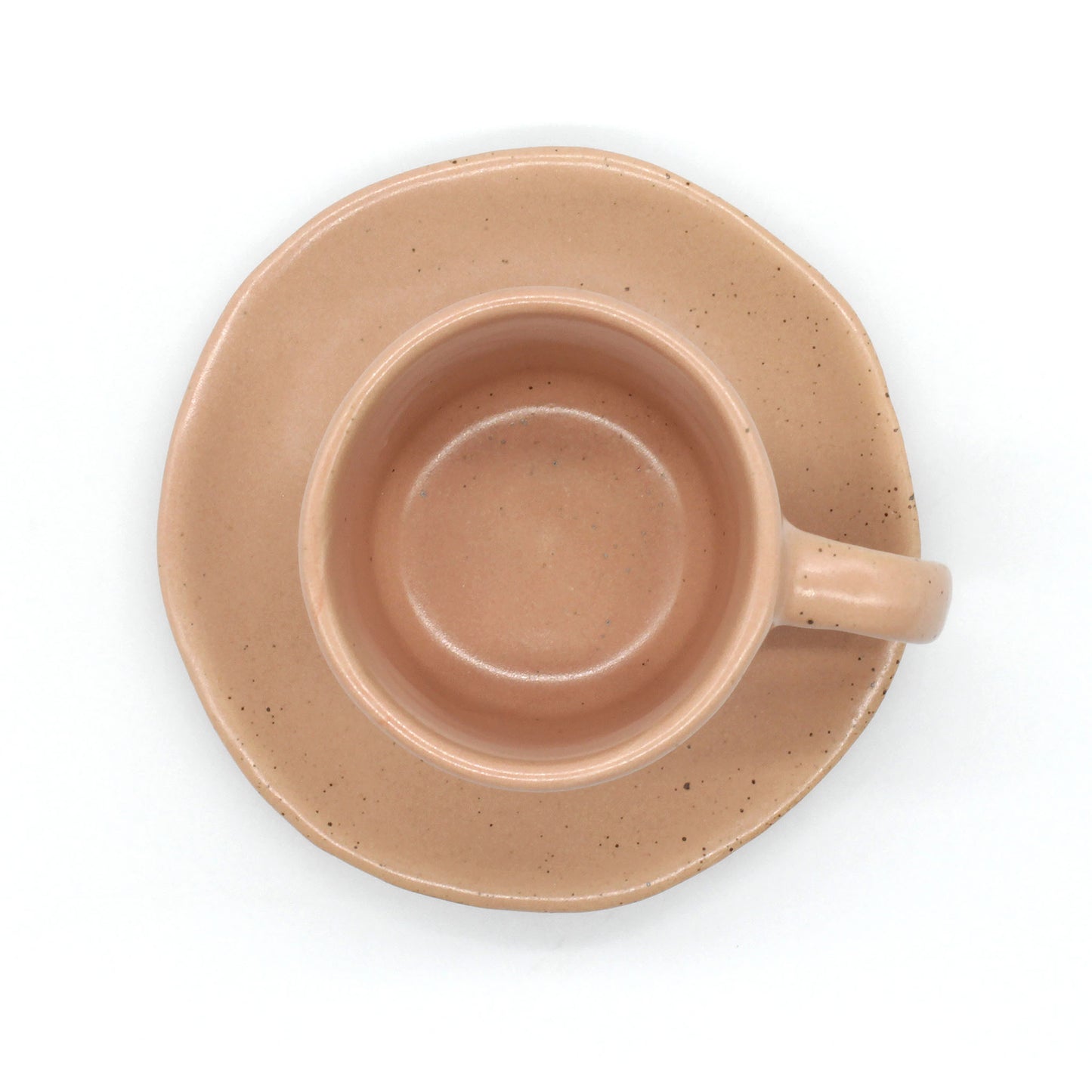 Handmade double espresso mug and saucer set in peach and clay colour with fine dark speckles.