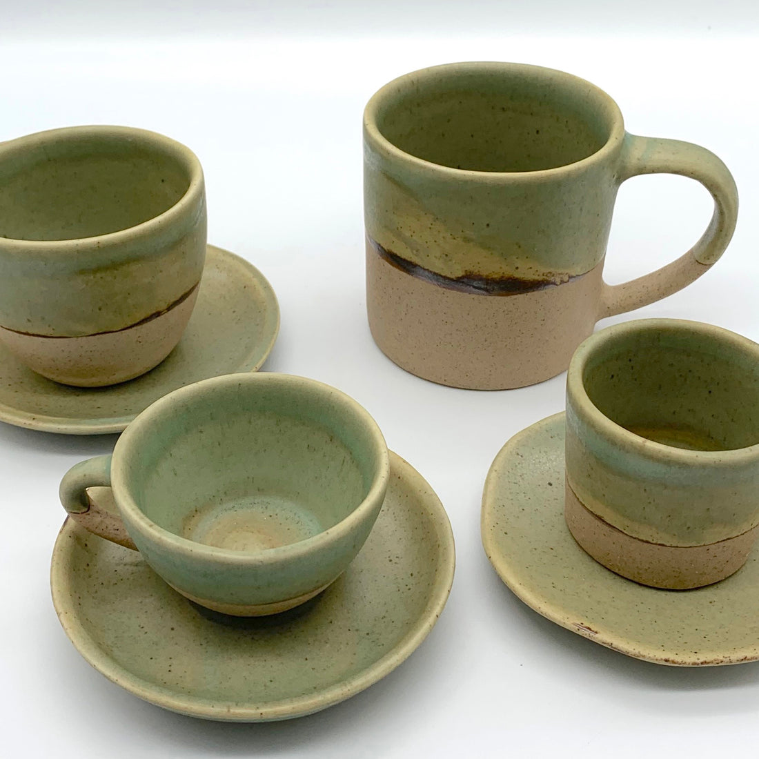 Mugs, espresso cups and tea cup in earthy green tones over speckled clay creating a two tone effect. Simply a pleasure to use.