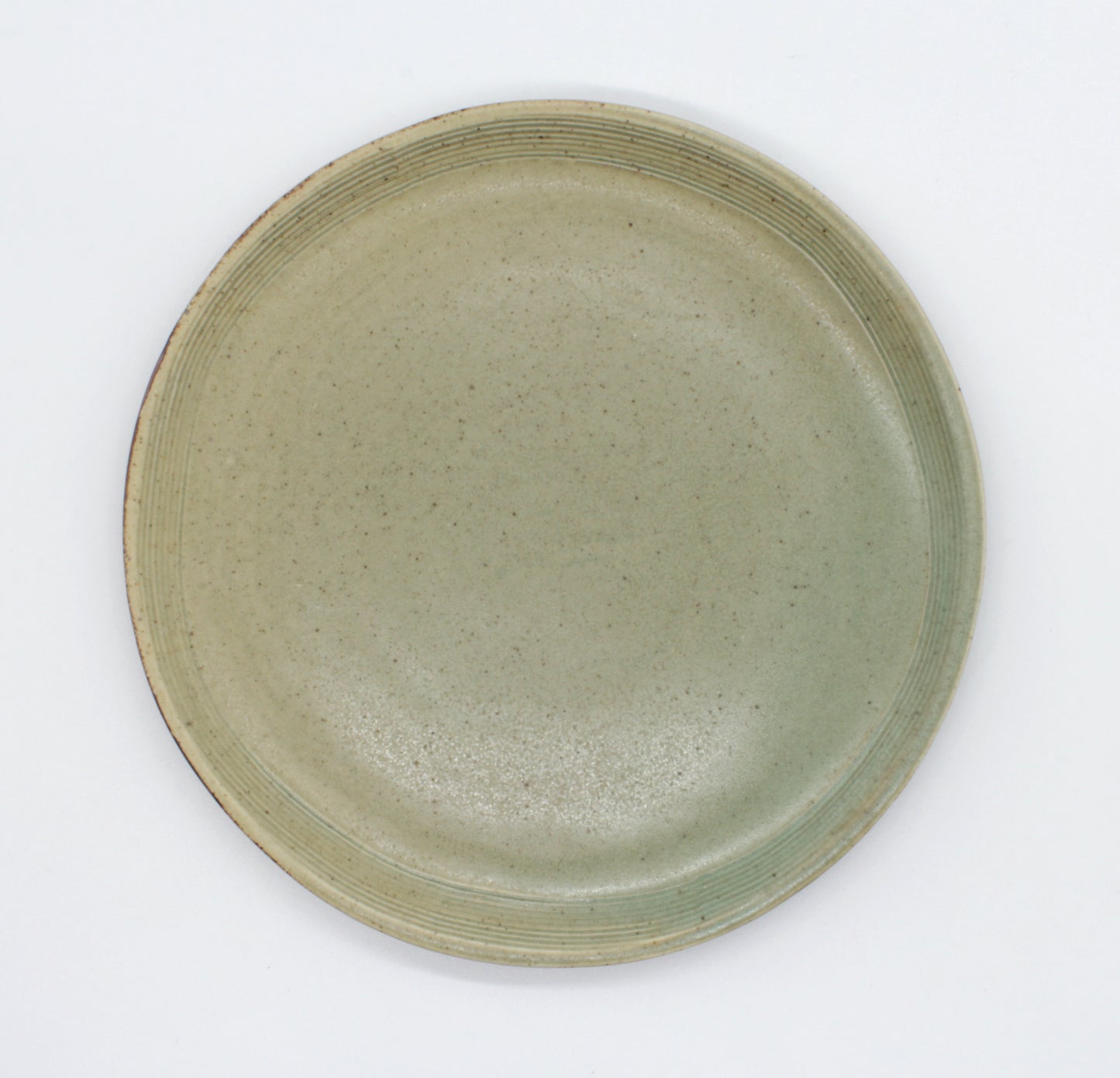 Overhead view of side plate from our Pandan collection. Our Pandan collection has a lovely earthen tone, setting an elegant rustic look to your table.