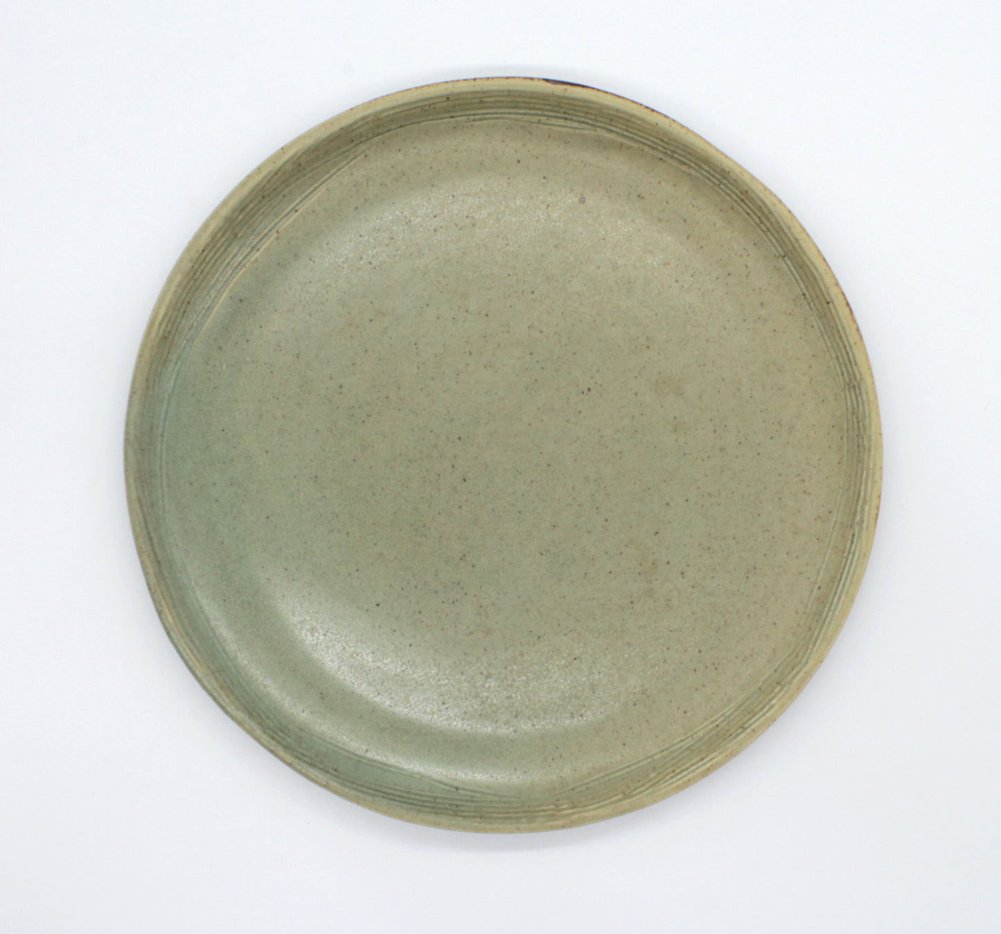 Overhead view of dinner plate from or Pandan collection. This moss colour collection has a lovely earthen tone, setting an elegant rustic look to your table.