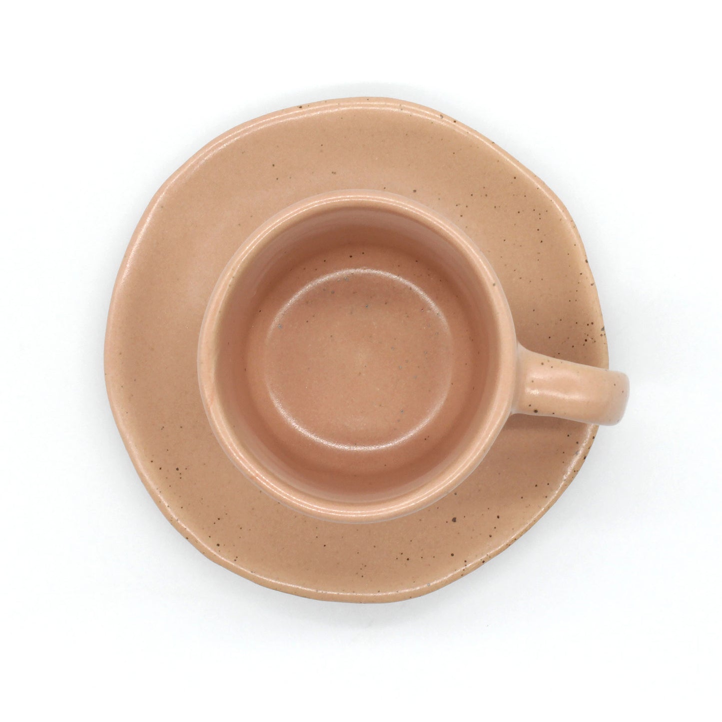 Handmade double espresso mug and saucer set in peach and clay colour  with fine dark speckles.