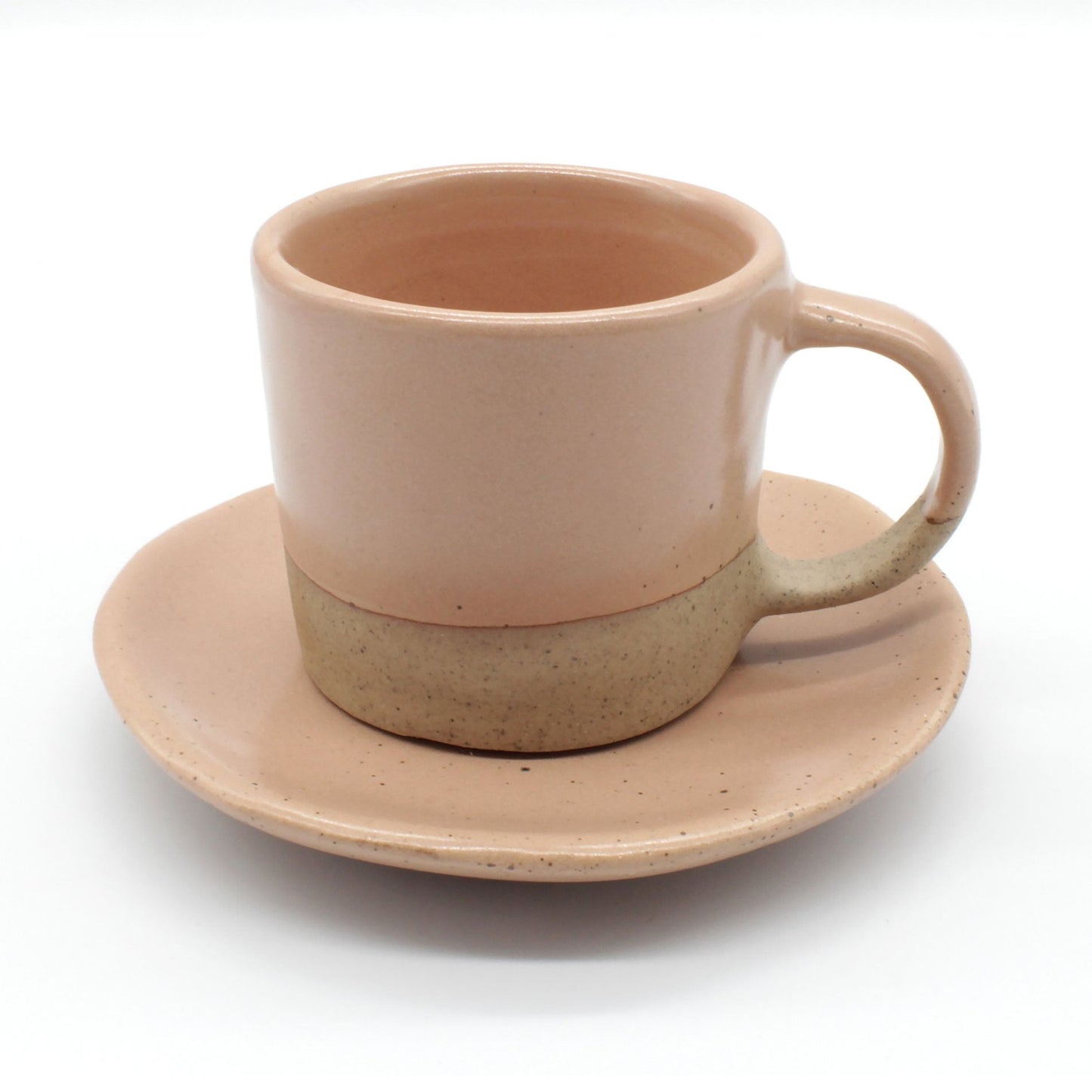 Handmade double espresso mug and saucer set in warm peach and clay  with fine dark speckles.
