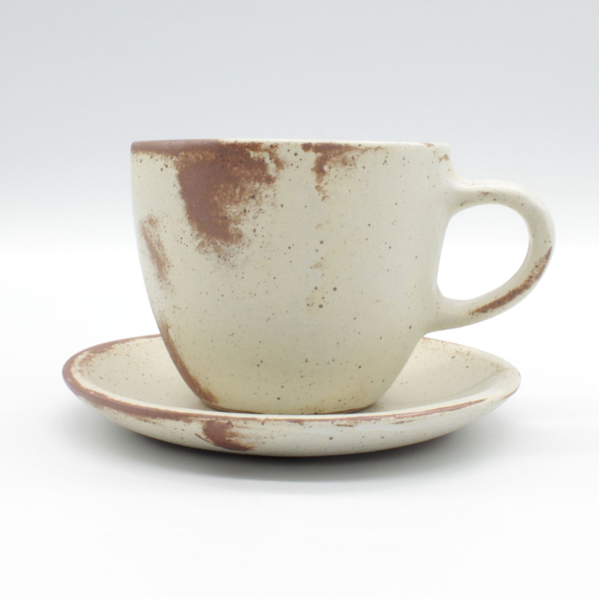 Lotus collection cup and saucer – handmade in antique white colour with touches of clay colour.