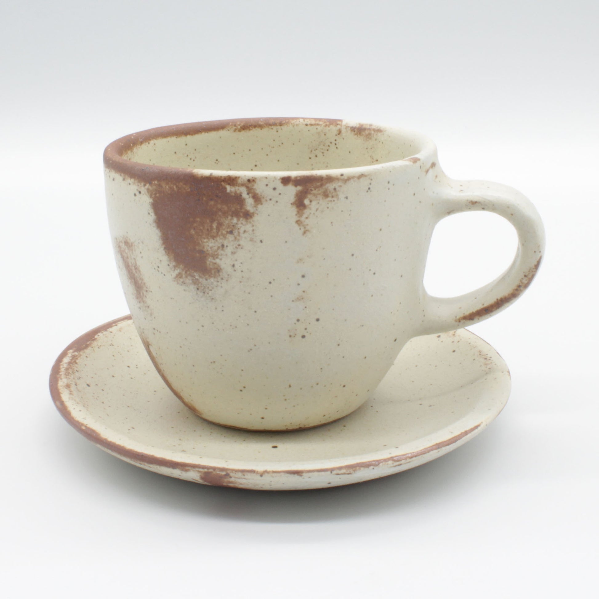 Lotus collection cup and saucer – handmade in antique white colour with touches of clay colour.