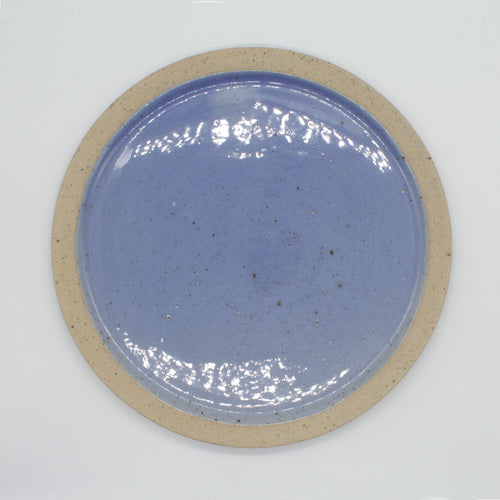 Overhead view of dinner plate from our Napa collection. Cornflower blue and glaze encased in the bare clay texture.