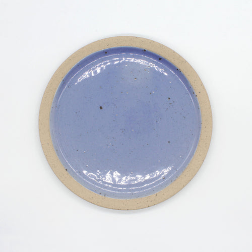 Overhead view of side plate from our Napa collection. Cornflower blue and glaze encased in the bare clay texture.