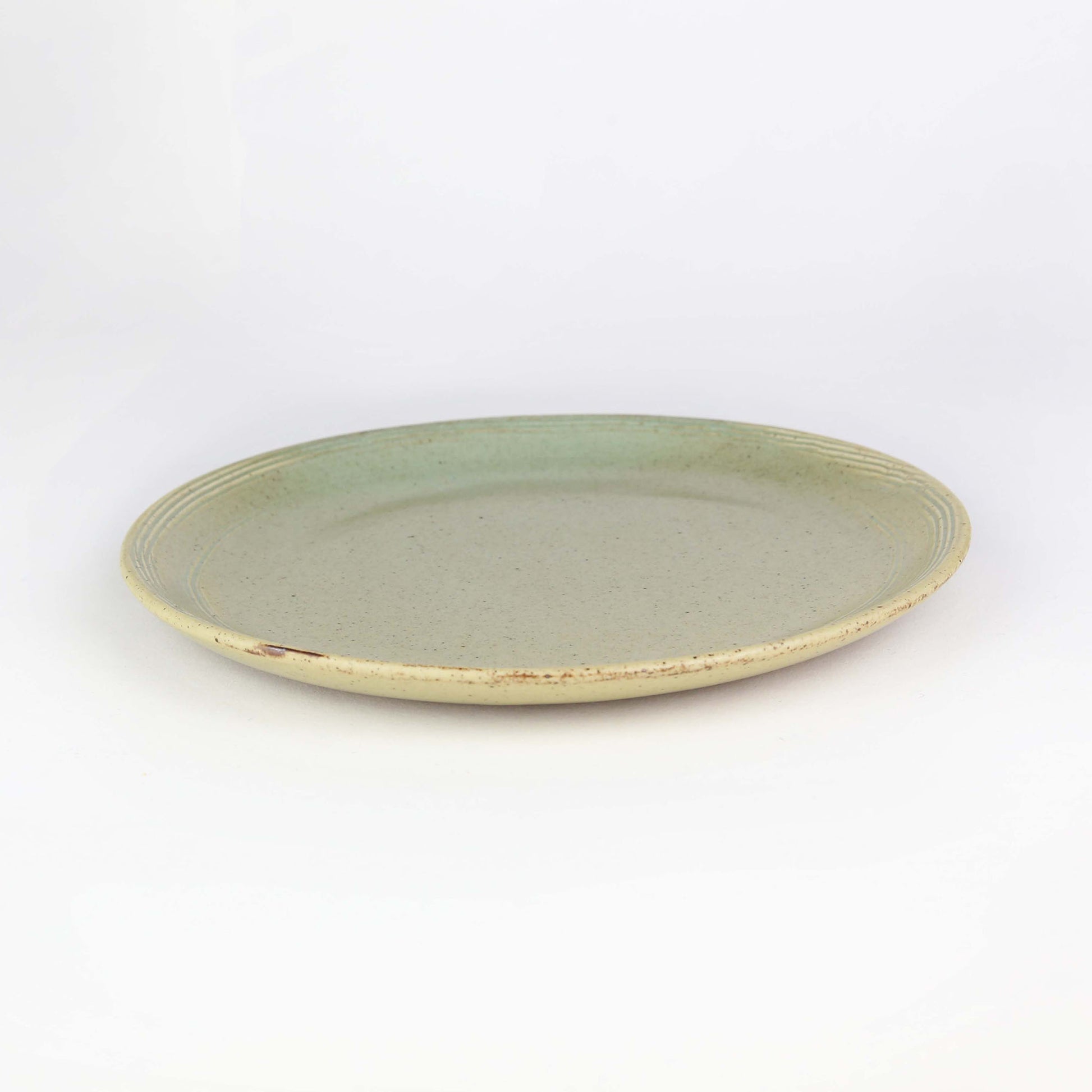 Side view of side plate from our Pandan collection. Our Pandan collection has a lovely earthen tone, setting an elegant rustic look to your table.