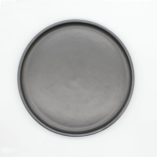 Overhead view of Tharn dinner plate. The Tharn collection is our black semi-gloss collection, that will enhance the appeal of each dish that you may serve.