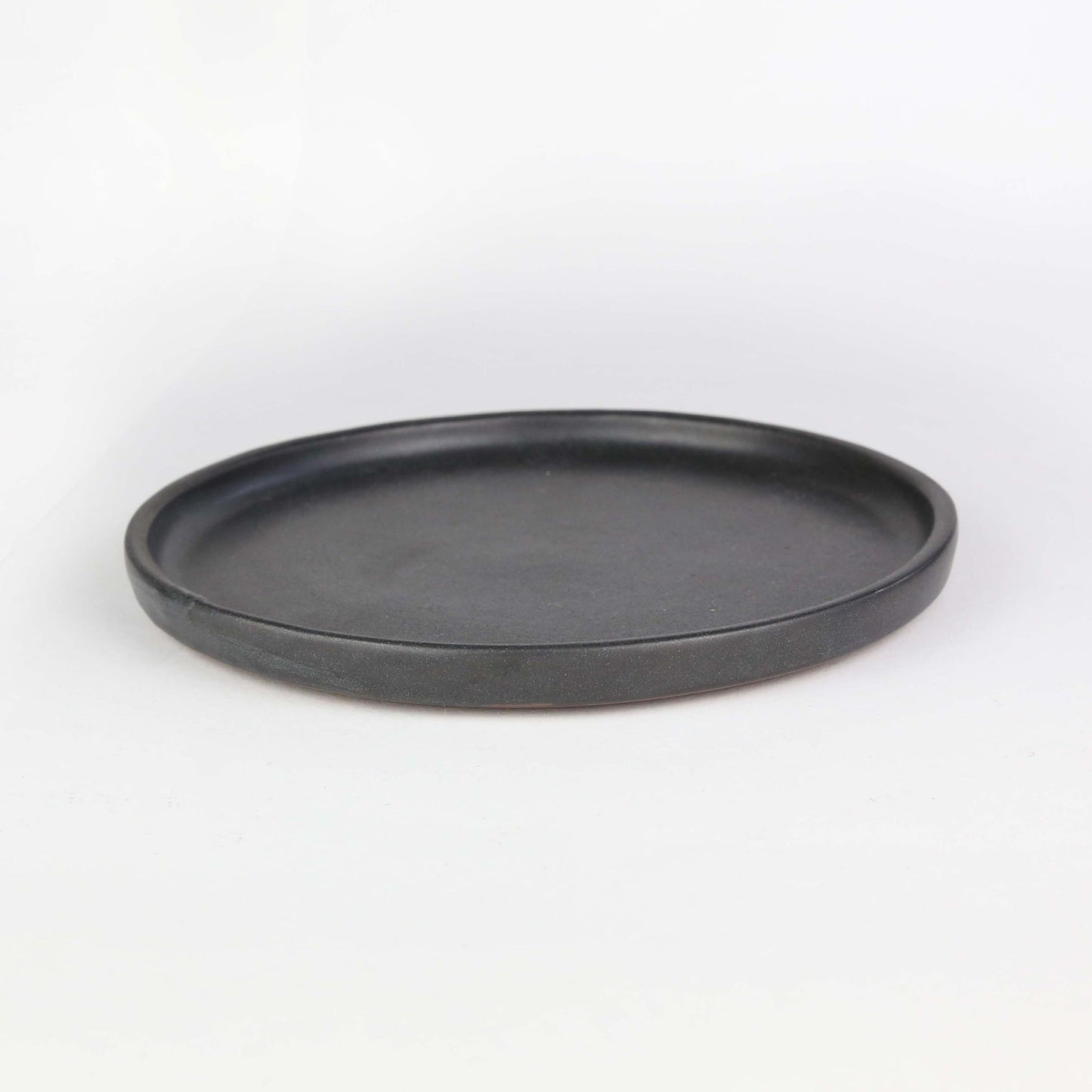 Side view of Tharn side plate. The Tharn collection is our black semi-gloss collection, that will enhance the appeal of each dish that you may serve.