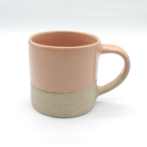 Handmade two-tone mug from our Isariya collection, Peach colour and pale clay colour with fine black speckles.